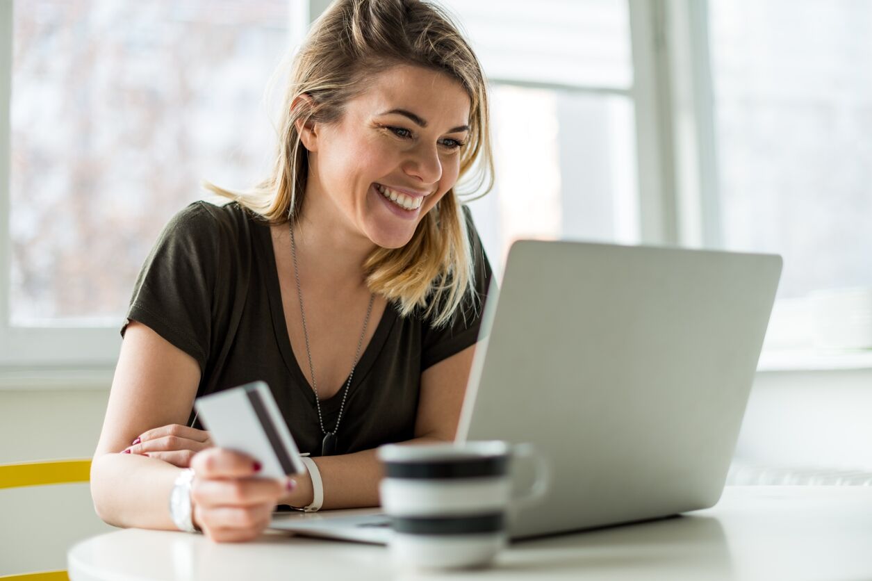 Internet shopping Young woman shopping online and paying with BAMS or PayPal