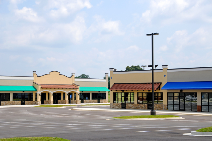 Commercial store fronts in an empty shopping center due to the possible increase in e-commerce